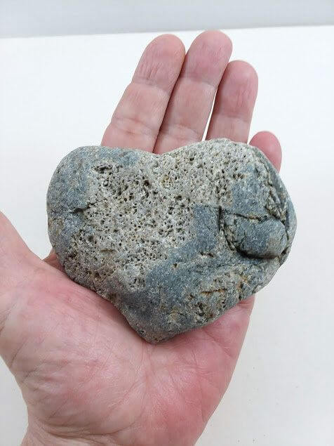 heart shaped stone in a hand the oathing stone ceremony with the celebrant angel