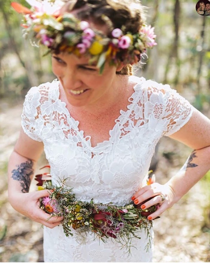 10 Tips for Choosing the Perfect Wedding Photographer _ A Practical Wedding bride putting last touches to her dress before here wedding, wedding day wobbles with the celebrant angel