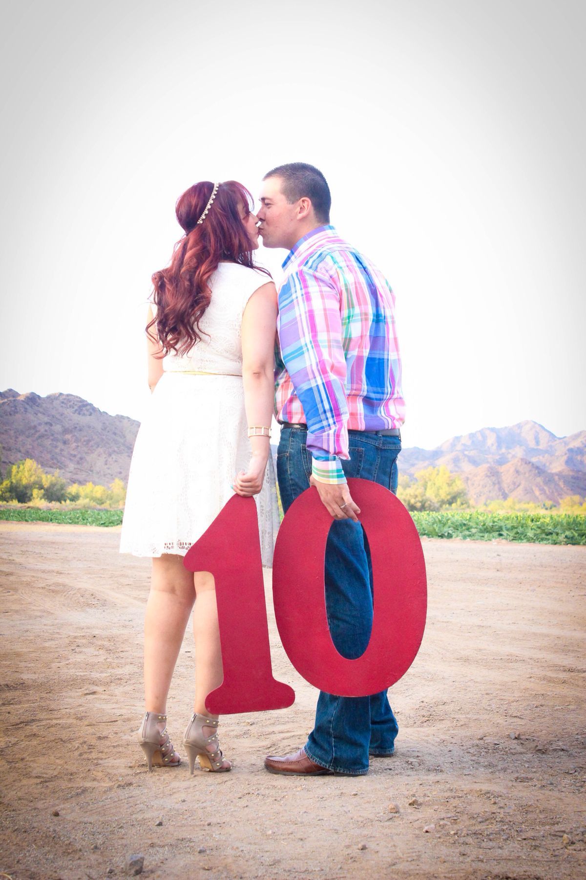 vow renewal celebrant Mary Gibson couple kissing holding a number 10 couples page vow renewal ceremony with the celebrant angel aberdeen