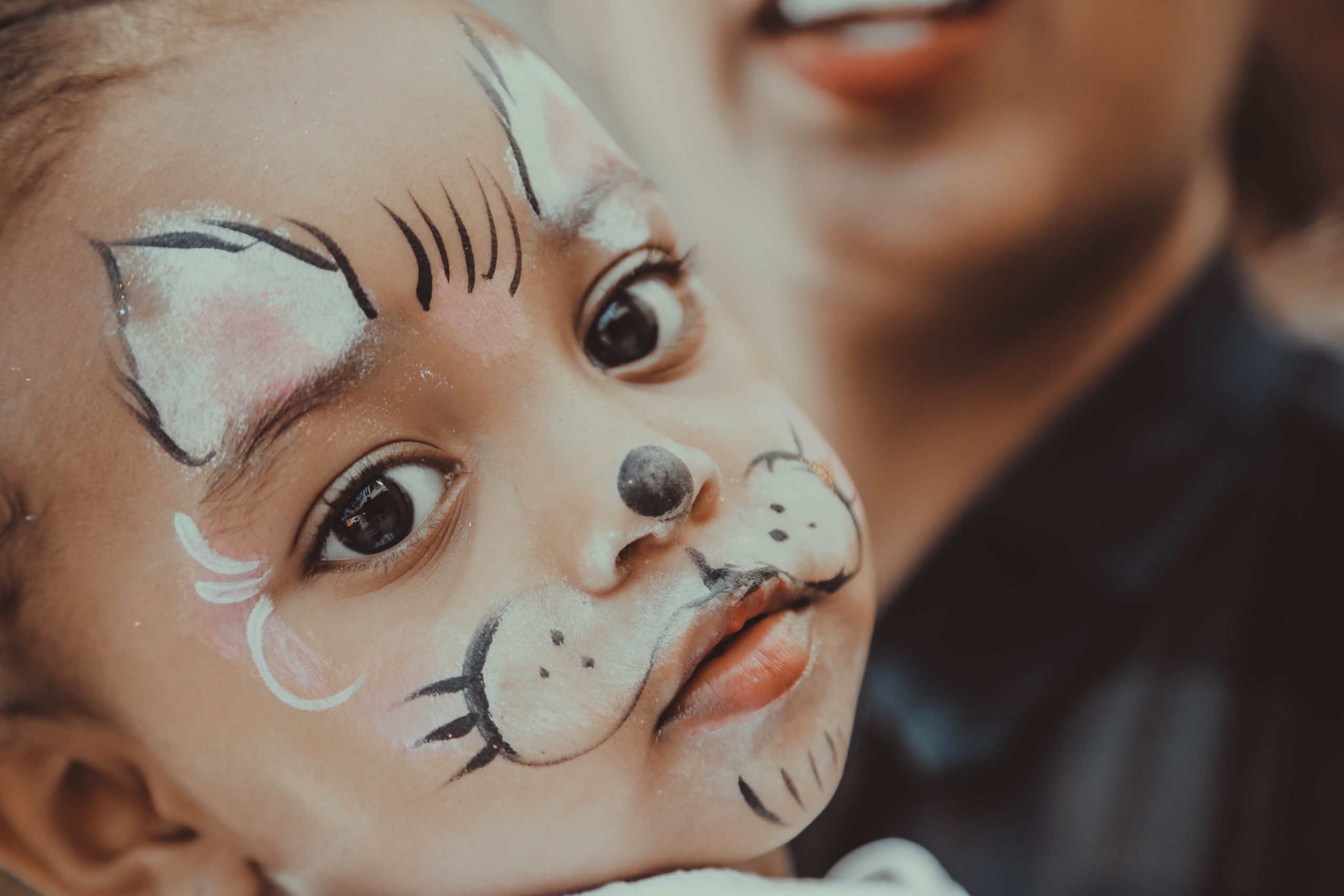 gift-habeshaw-v85OoZ2N1BI-unsplash child with face painted like rabbit family and naming ceremonies in aberdeen
