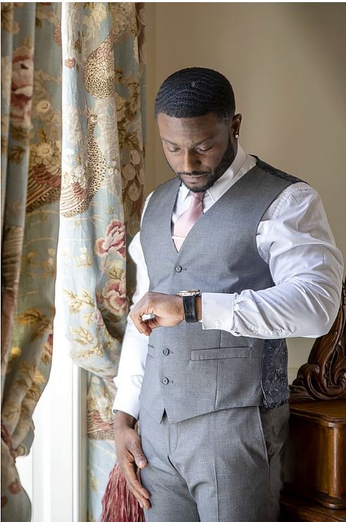 how-long-does-it-take man looking at watch top tips on a wedding receiving line