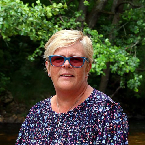 mary square 3 Mary Gibson, the celebrant angel aberdeen sitting by the river wearing sunglasses
