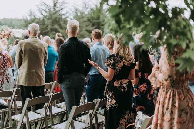 samantha-gades-ermkZ9xvhdU-unsplash group of people at a wedding top tips on how to downsize your guest list