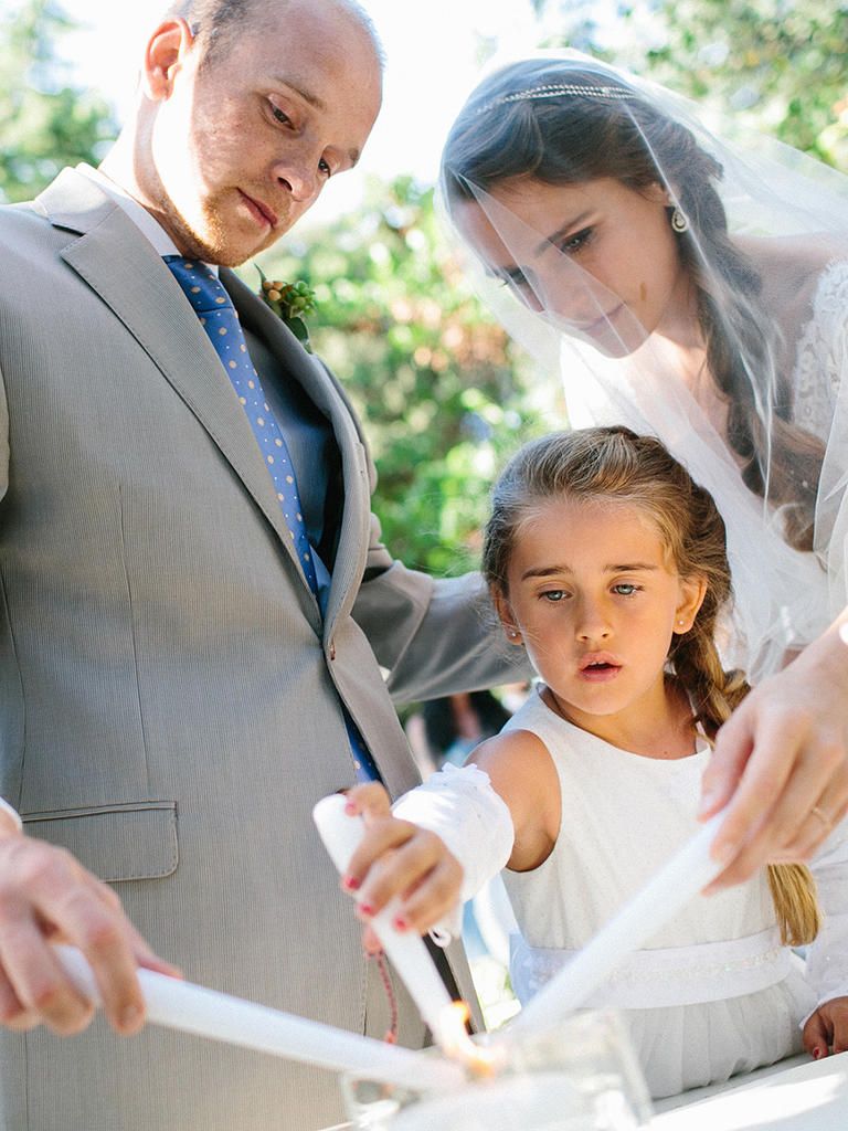 13 Alternative Ideas for Your Unity Ceremony family lighting a unity candle at their ceremony unity candle ritual