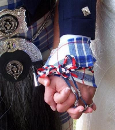 Handfasting Ceremony a handfasting tie round a couples hands