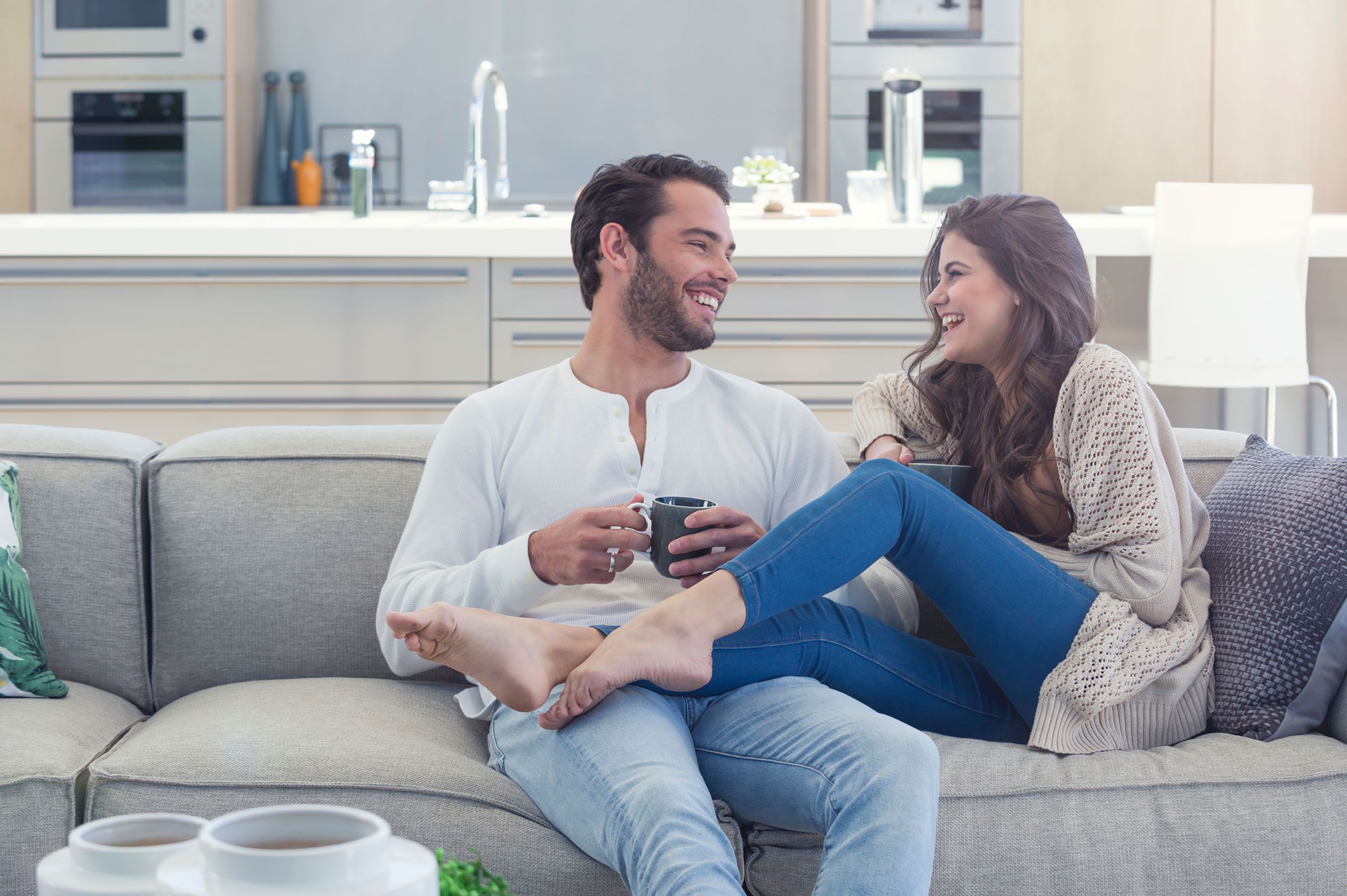 State of the Union Meetings Will Strengthen Your Relationship_ Here's How to Start Yours couple having coffee laughing how to reduce stress while wedding planning