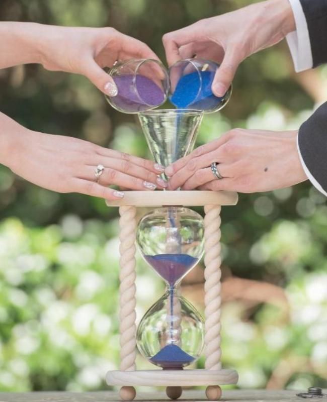 The Natural Unity Sand Ceremony Hourglass™ in Poplar or Oak by Heirloom Hourglass couple doing a sand blending ceremony