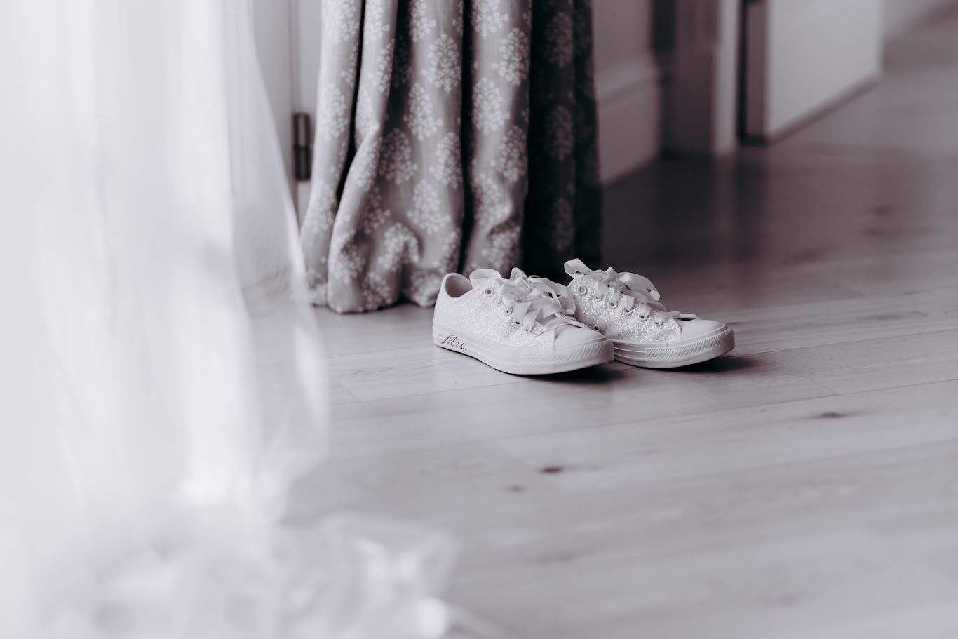 a pair of white wedding trainers for lindsay's wedding at aswanley