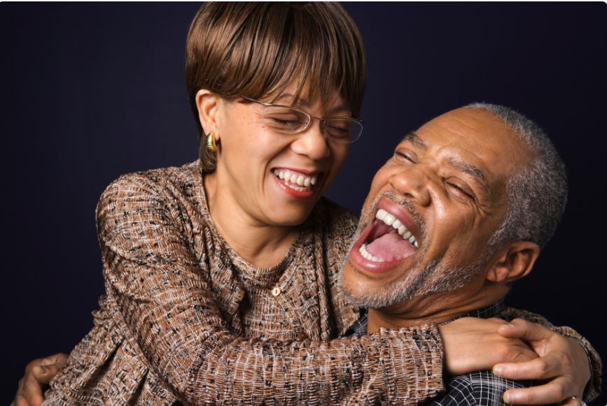 laughing couple laughing together