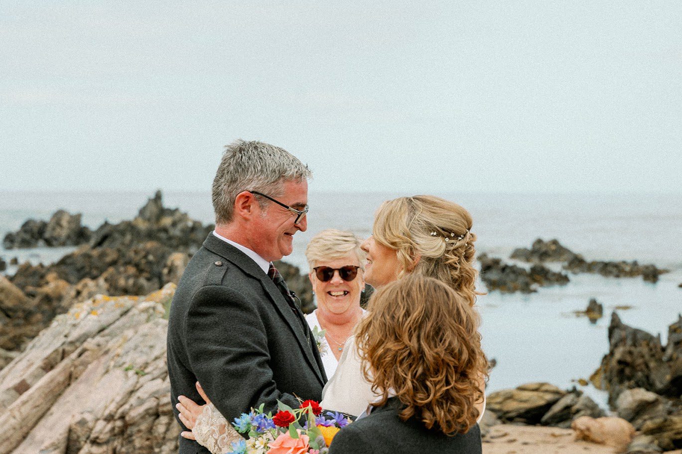 a wedding ceremonny for two on the beach in cullen for janetter and duncan and their boys