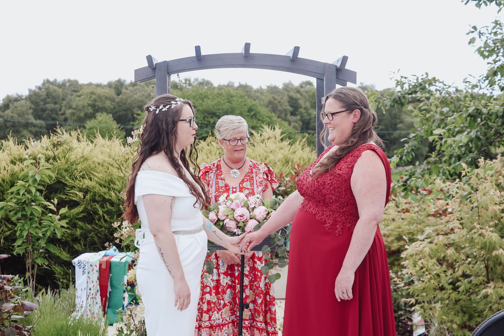 a wedding ceremony for two in their home garden 