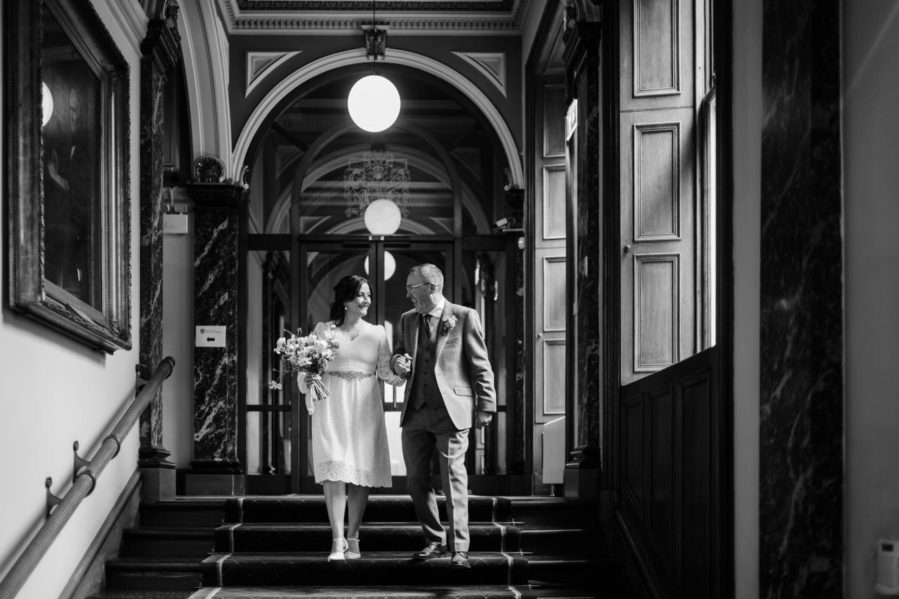 a couple doing their first kiss as husband and wife in their wedding ceremony at Meldrum House
