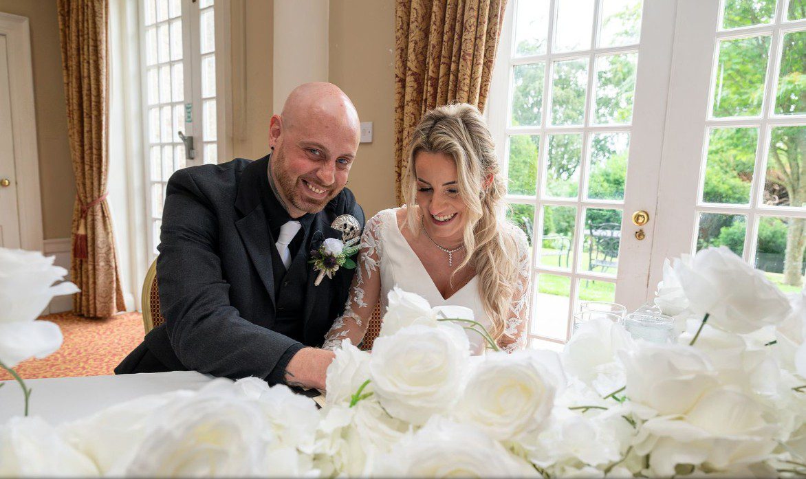 Courtney and Tris filling in their forms at their wedding at Pittodrie House Hotel